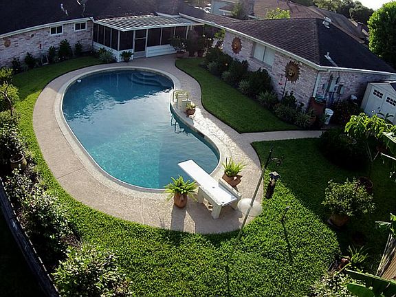 Welcome to your backyard oasis! Screened patio, pool recently replastered with pebbletech surface and diving board. 3 storage sheds stay, over-sized garage with cabana 1/2 bath!