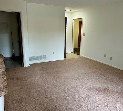 View of entry of 2201 C from dining area- doorway on left is the laundry room