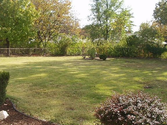 Level, fenced backyard