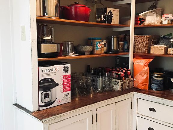 Walk in pantry accessible from kitchen and dining room.