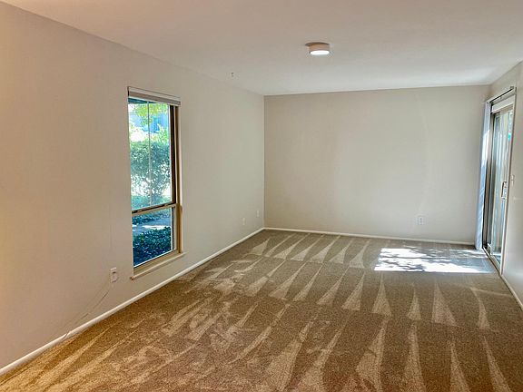 Spacious living room with sliding doors to private patio