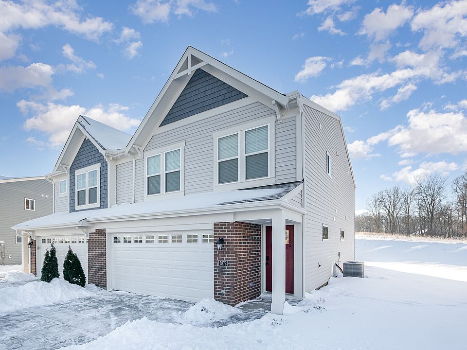 front of house on a beautiful snow day