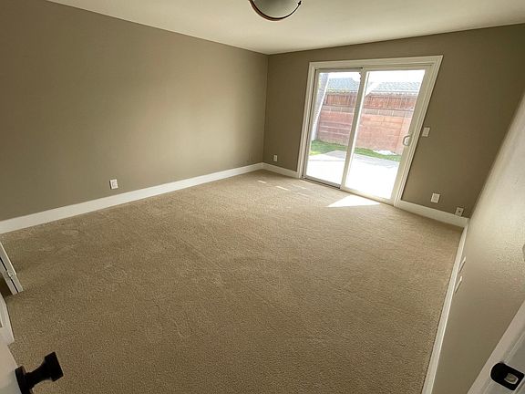 Master bedroom. Doors leading out to private backyard.