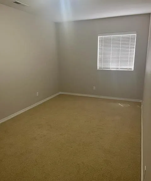 One of two basement bedrooms.