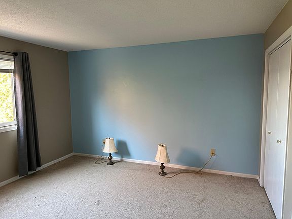 Accent wall has been repainted to match others.