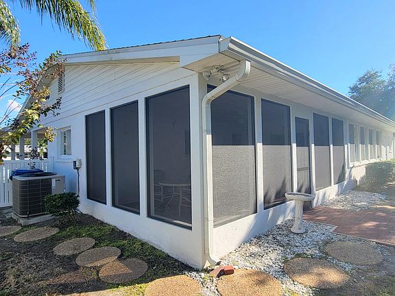 Private screened in Lanai overlooking fenced in back yard.
