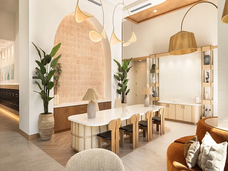 Luxurious modern apartment interior featuring an elegant dining area with a marble table, chic lighting, and contemporary decor, exuding warmth and sophistication.