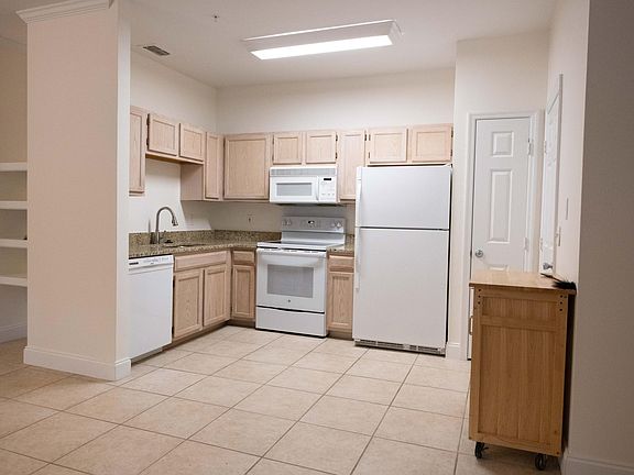 Kitchen with new granite counter tops, new stove and new dishwasher.