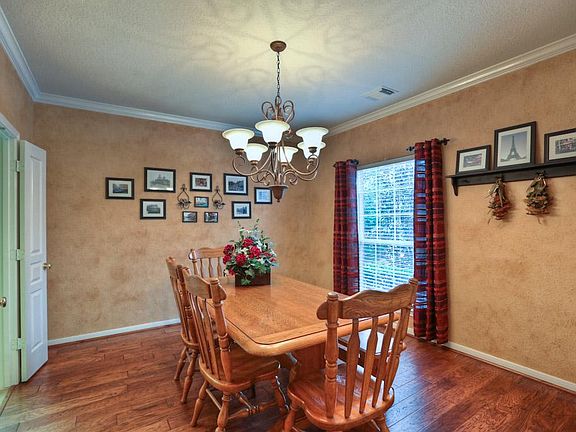 Formal dining has convenient access to the kitchen.