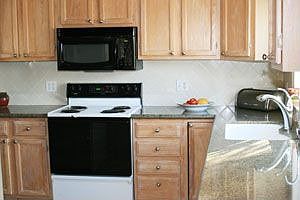 Granite counters, new dishwasher and microwave, tile floor