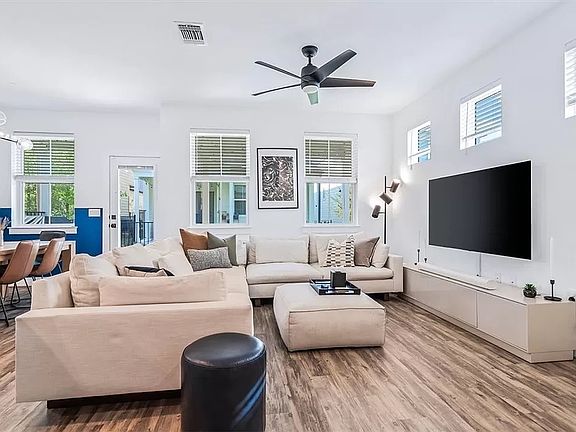 Bright open-concept living room with wood-look vinyl plank flooring