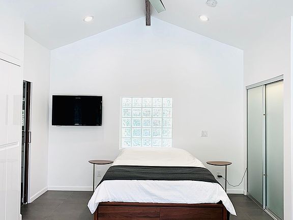 High Ceilings with Remote controlled fan and AC/Heat. Dimming Lights for bedroom area.