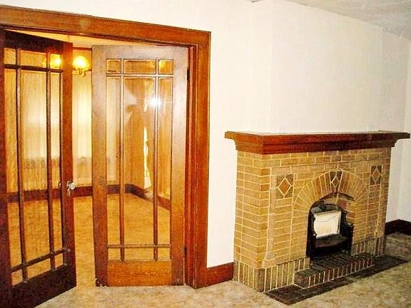 Living rm w/view to formal dining; mock fp with gas stove