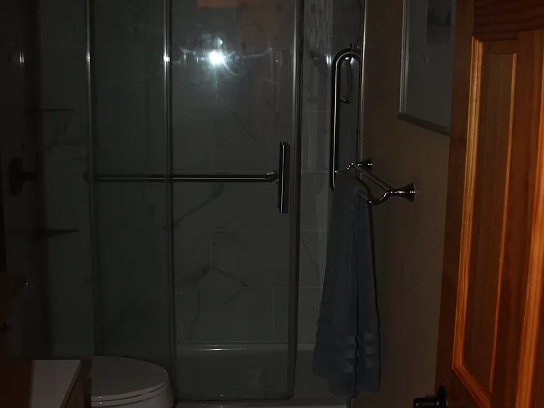 Shower/bathroom. (sorry so dark)