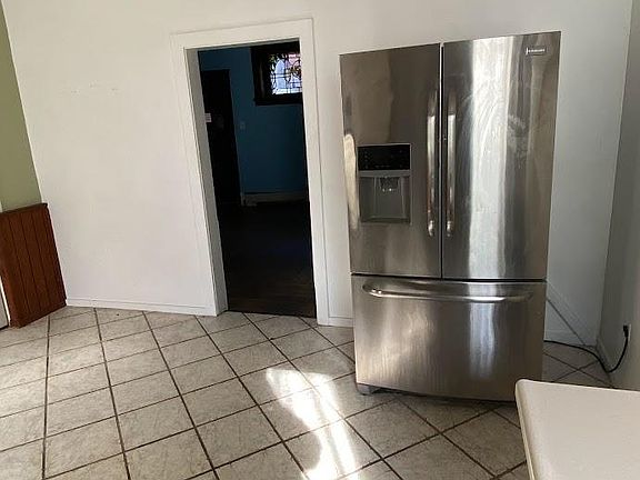 Kitchen - stainless steel refrigerator with filtered water and ice-maker