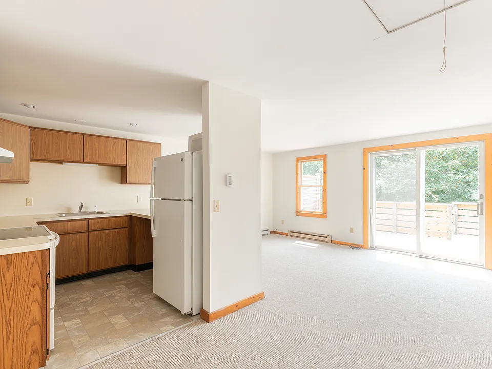 Kitchen and Living Room with sliders to a private deck