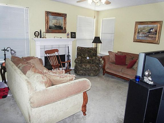MAIN DEN WITH FIREPLACE