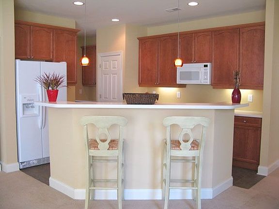 Kitchen w/ upgraded cabinets, Corian