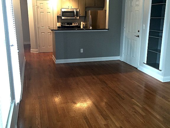 Well lit open layout livingroom kitchen