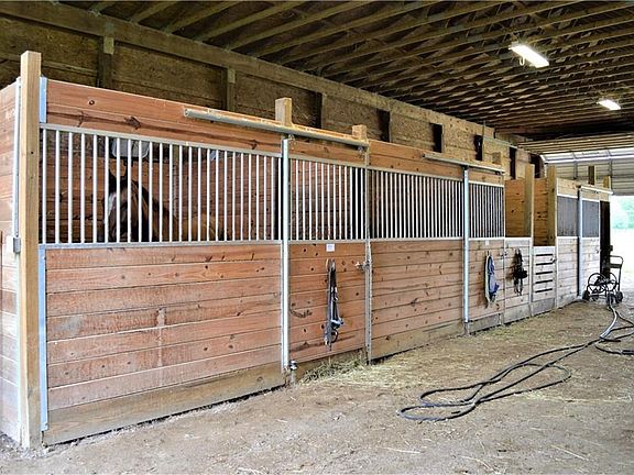 7 Stalls 12x12 concrete /rubberized floor pads, upgraded hardware =pampered horses.