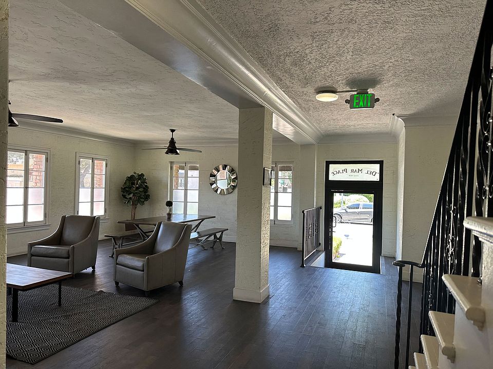 Front door in lobby and stairs to second floor units at Molino Del Mar Apartments in Pasadena, California.