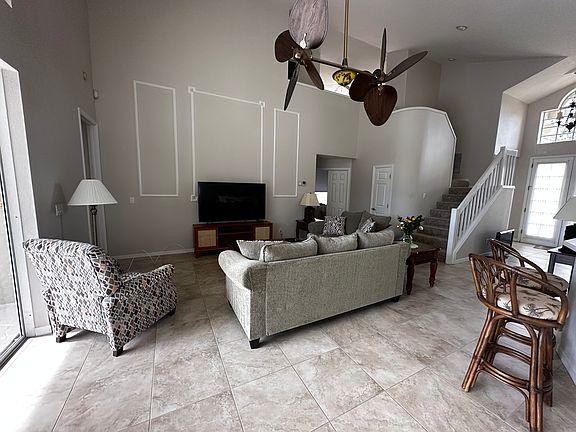 Living Area with Paddle Fan & 65" Samsung 4K Smart TV