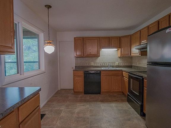 The updated Kitchen provides newer appliances and an open design into the Dining area.