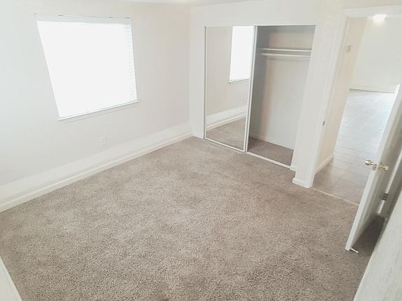 Bedroom w Mirrored Closet