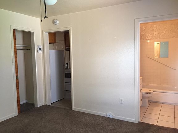 Bedroom, looking to kitchen/bath