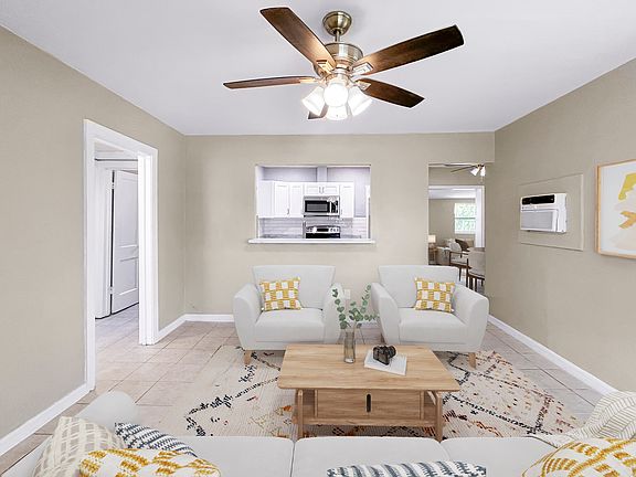 Your living room provides easy access to the kitchen with a pass-through window.