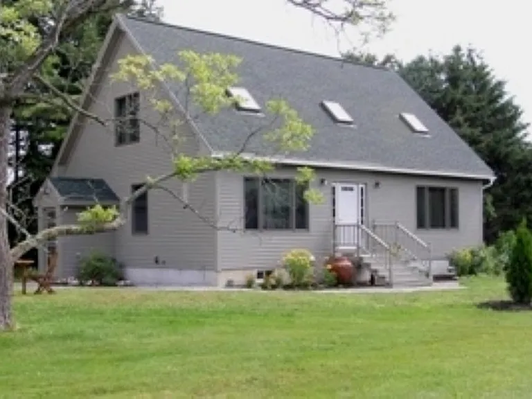 Front of House view of gardens and front pond
