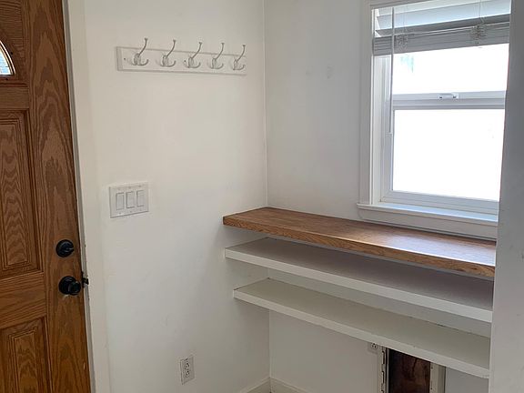 Front entry room with doggie door