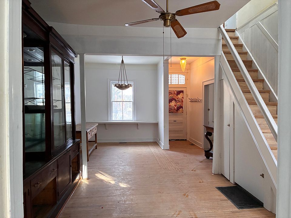 Looking from the kitchen through the living and dining room towards the front door.