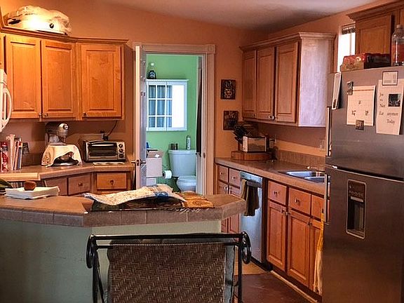 Kitchen leading to 1/2 bath