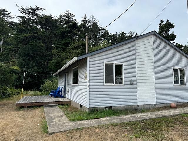 Exterior of house with deck and chairs