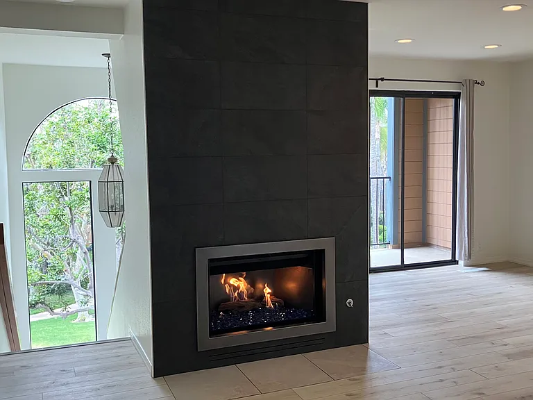 Living area, newly refinished fireplace.