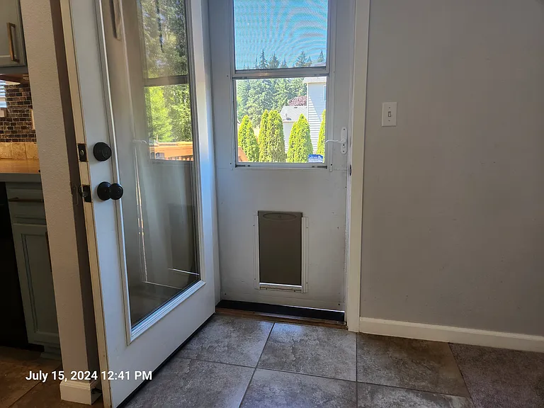 Dog door to fully fenced backyard