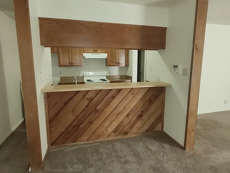 Looking from dinining area into kitchen for 2 bedroom apartment