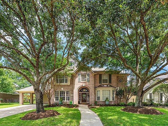 The large trees give this home magnificent curb appeal!