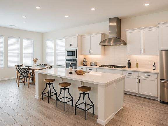 Large kitchen with stainless appliances. Fully stocked with plates, silverware, cooking utensils