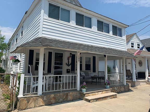 Front of house with large porch. House is on a short quiet one-way street.