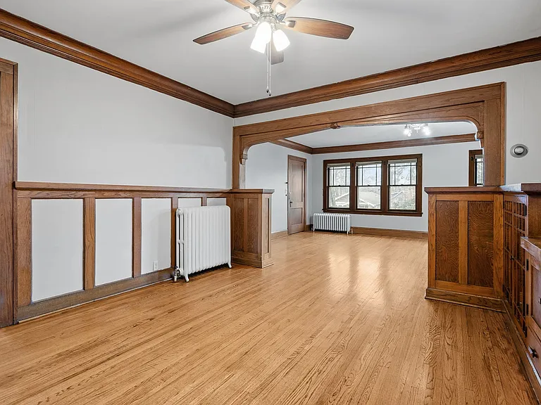 Welcome to Central Lakes of Uptown, where elegance meets comfort. This spacious living area, featuring beautiful hardwood floors and classic architectural details, is perfect for relaxation. Schedule a tour today and envision your new home!