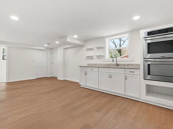 Kitchen & dinning space. Refrigerator and cooktop burners will be included upon move in.