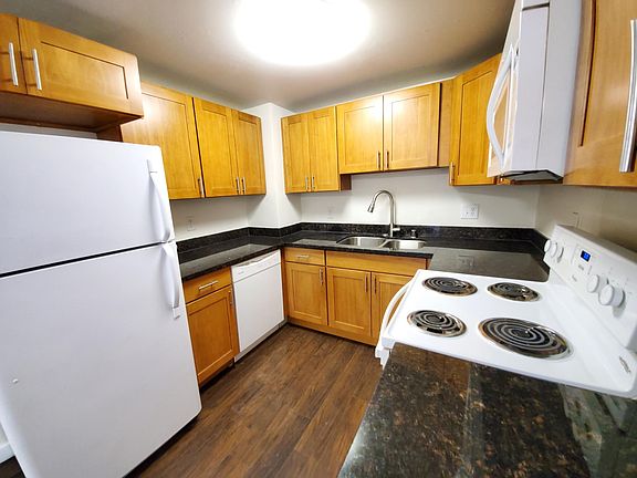 The kitchen has everything you need: fridge, dishwasher, microwave and and electric range/oven.