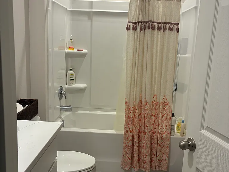 Bathroom located between bedroom 1 and 2 and 3 , easily accessible as you walk into the home.
