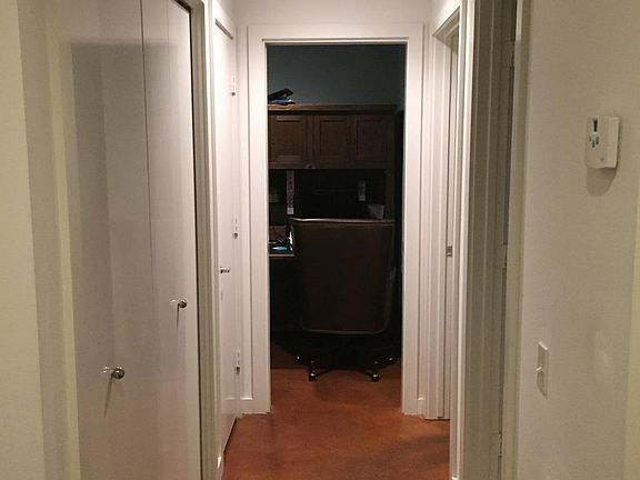 Hallway leading to first floor bedroom and bathroom