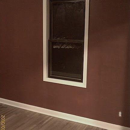 Refinished 1st story bedroom floor, walls and trim in 2009