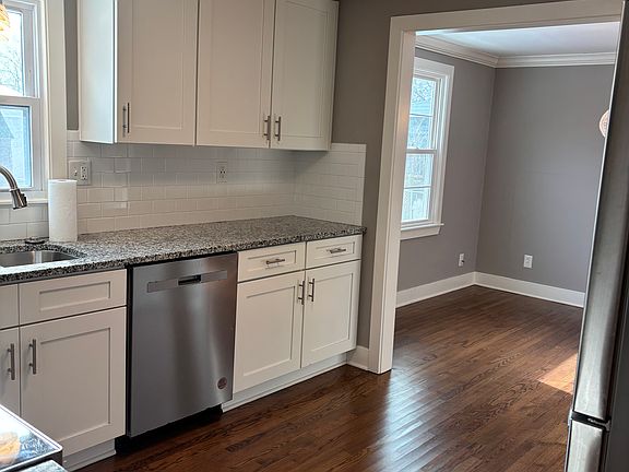 Kitchen with stainless steel appliances and granite counters