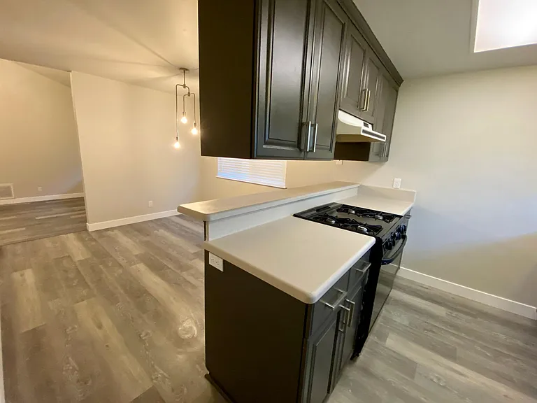 Fresh coat of kitchen cabinet paint, refinished countertops, brand new kitchen hardware.