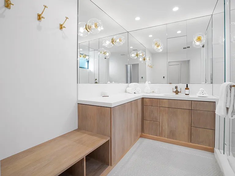 Luxury meets function with sleek finishes and custom wood cabinetry.